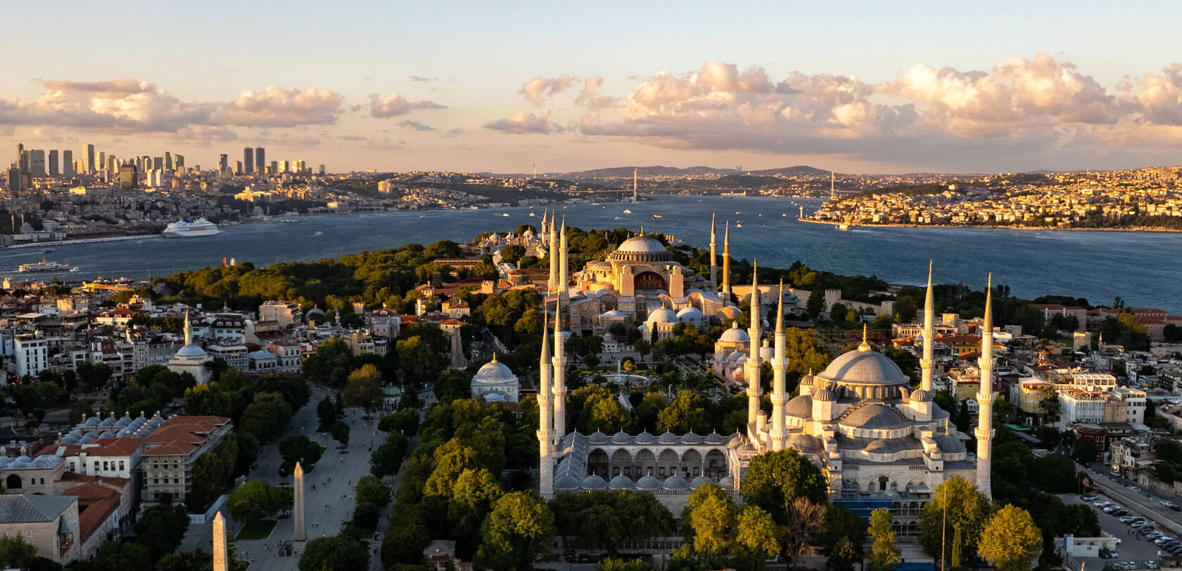 Aerial view of Istanbul's historic peninsula — the Blue Mosque and Hagia Sophia above the Bosphorus